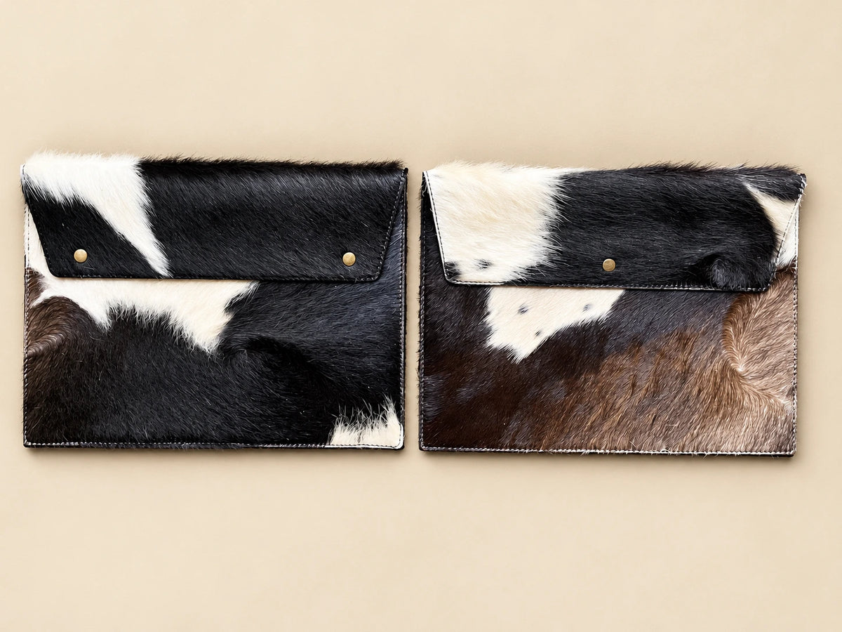 Two ADEEM cowhide sleeves showing different natural hide markings